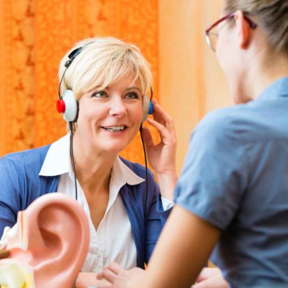 Patient doing a hearing test with an audiologist