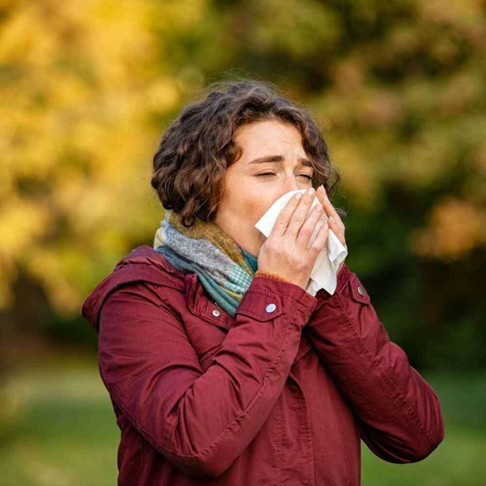 Woman experiencing environmental allergies