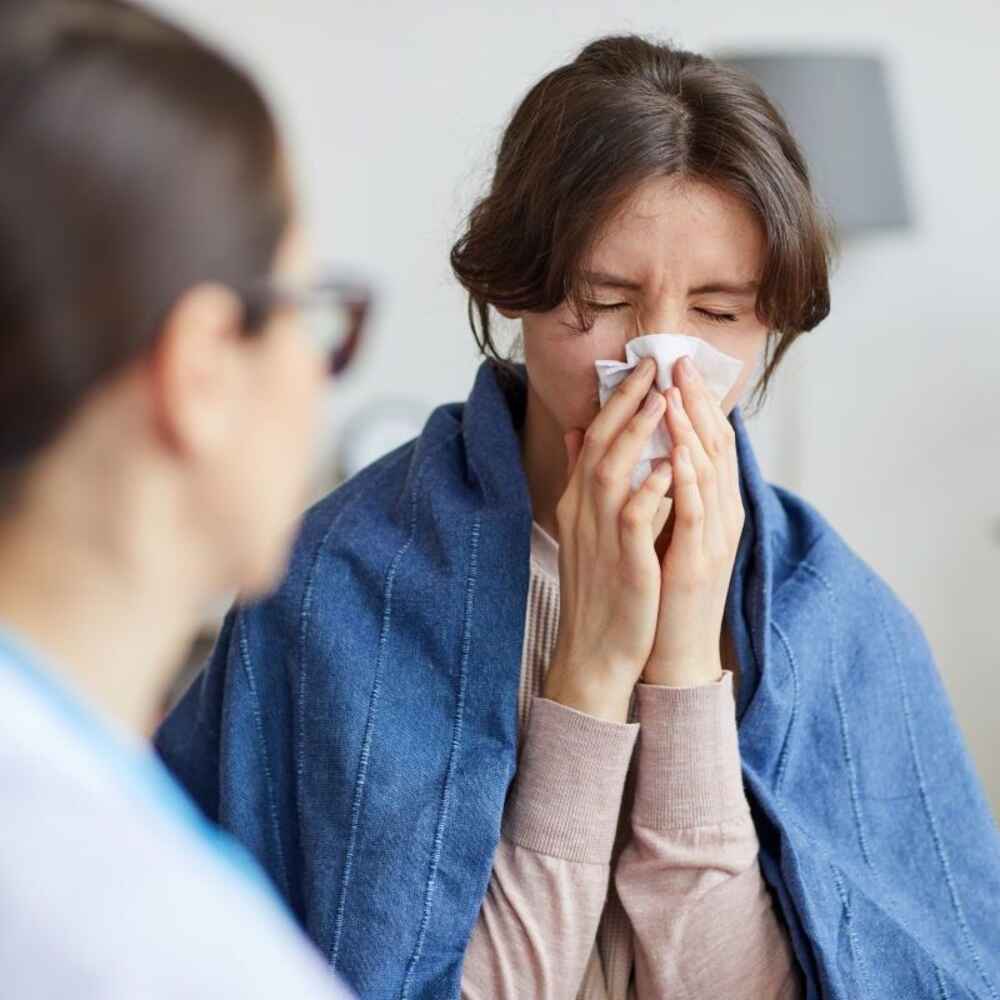 Woman with sinus issues visiting an ENT doctor and allergist