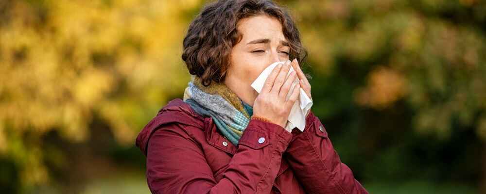 Woman experiencing environmental allergies