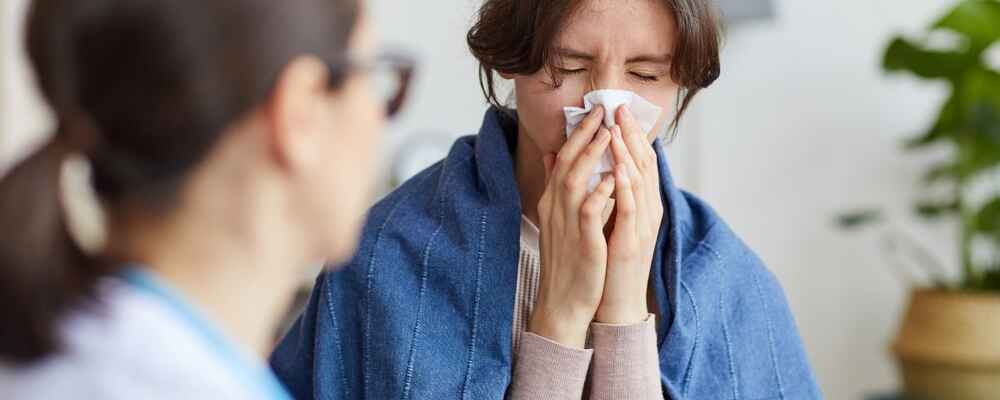 Woman with sinus issues visiting an ENT doctor and allergist